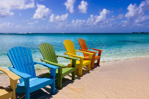 istock Wooden chairs on the beach 1472754289