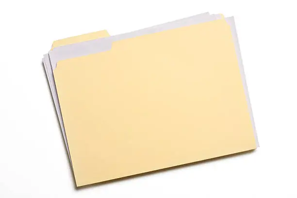 Documents stuffed in a Manila folder isolated on white with soft shadow.