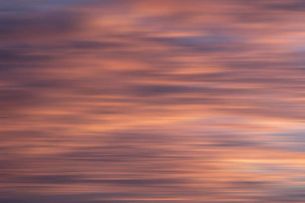 istock Abstract blurred colourful vibrant sunset for use as a background 1472756378