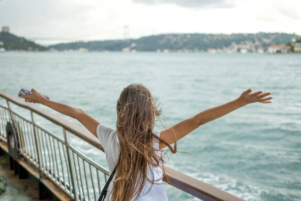istock Beautiful girl travelling with boat 1472756882