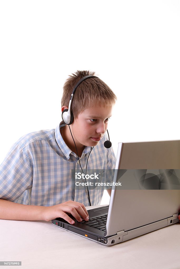 Young boy spending time with notebook Adult Stock Photo