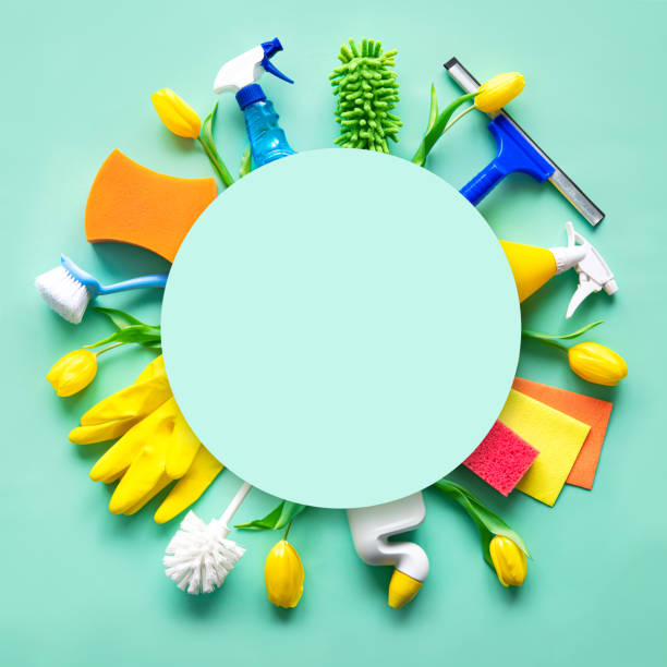 istock Flat lay composition with cleaning supplies, tools and spring flowers on colorful background 1472760313