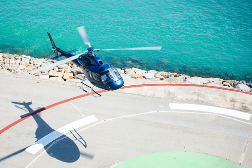 Mediterranean sea, France - January 18, 2012:  French troop transport helicopter Puma flying during windy day over the Mediterranean sea. The mission is to rescue hostages from capture.