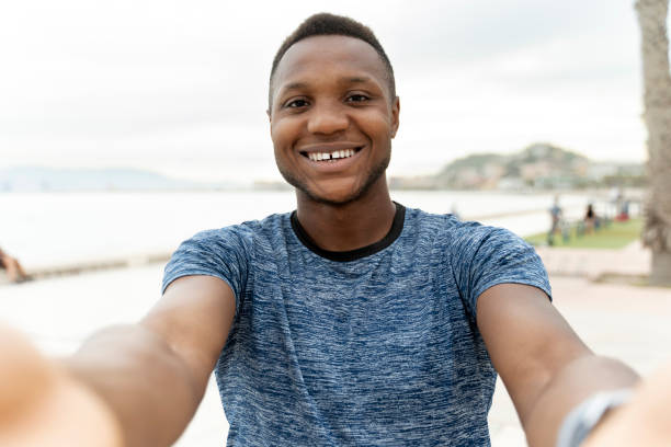 istock Handsome man taking a selfie or making video call after his training 1472767664