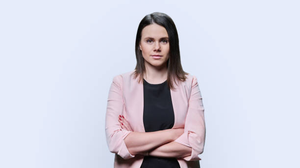 istock Confident business young female looking at camera on white background 1472770196