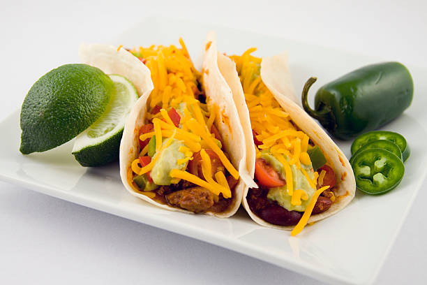 Beef and bean mexican burrito on red plate.