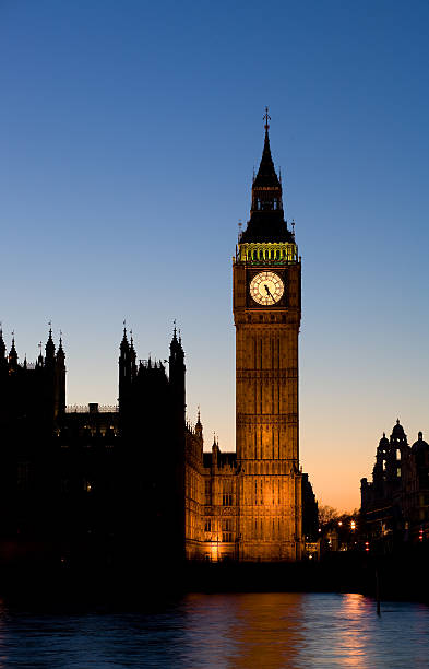 Big Ben silhouetted against the dusk sky stock photo