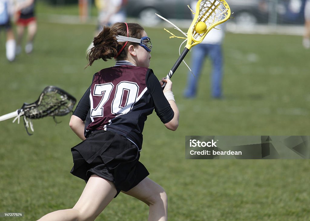 Lacrosse Cradle breaking away in girl's lacrosse Lacrosse Stock Photo