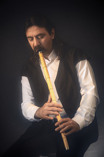 Turkish musician playing the reed flute