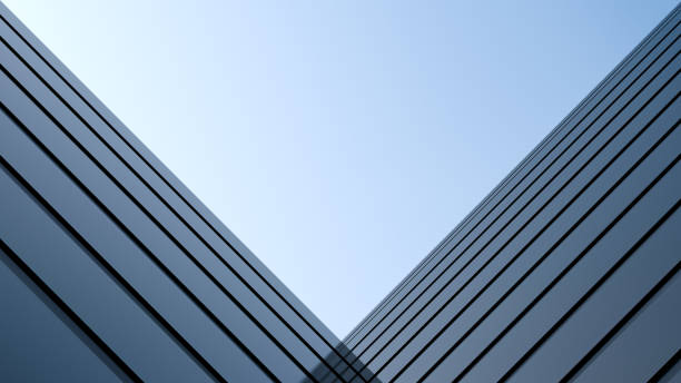 istock Corner building design. Architectural structure against the sky.Building with a reflective surface. 3D render. 1472784421