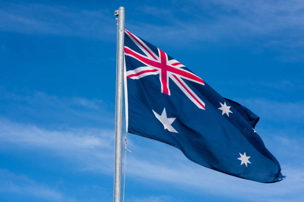 istock Australian flag waving in wind 1472787934