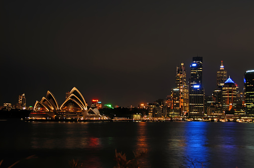 Sydney, New South Wales, Australia: Sydney Harbour at night with Sydney Opera House and city. Night view of Sydney Harbor.