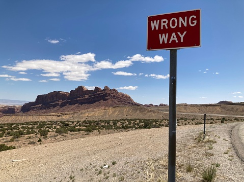 Wrong way sign on a desert road
