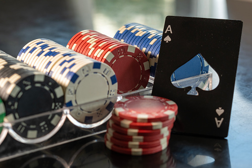 Ace of spades and poker chips in casino