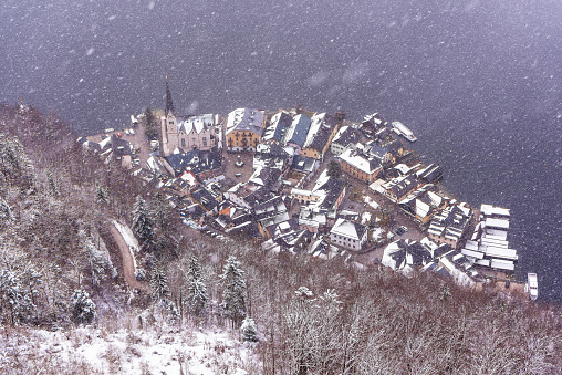 Aerial view of Hallstatt in Austria during snow fall in winter