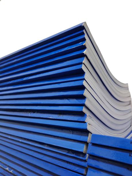 istock stacks of student papers or theses or books. 1472790114