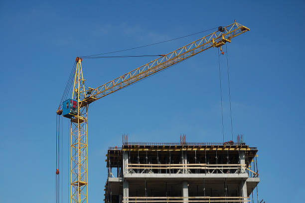 istock Crane and building on blue sky background 147279084