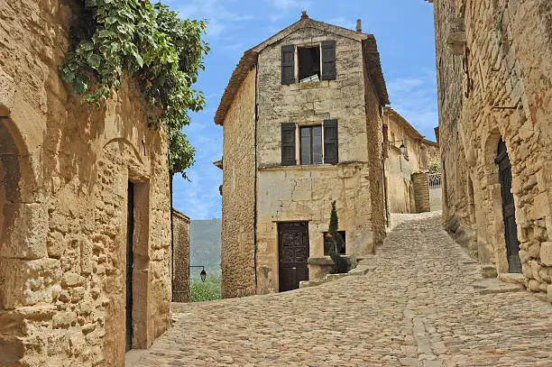 Cobblestone intersection in old French village of Lacoste in Provence.