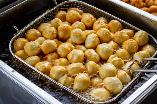 Photo of Fried Fish Ball In Boiled Oil On A Pan.