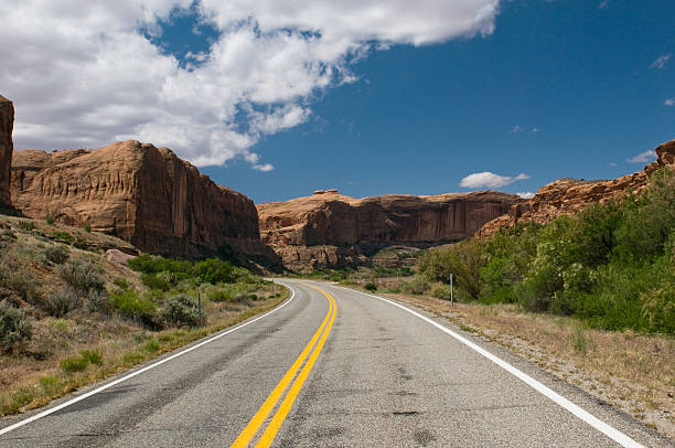 istock vibrant image of highway and blue sky 147279640