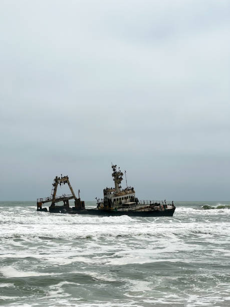 istock Sunken trawler, shipwreck. Old rusty metal ship Zeila at Skeleton Coast Namibia. 1472797488