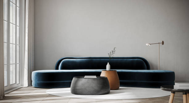 istock Modern interior design of living room with dark blue sofa and empty white wall background. 1472797497