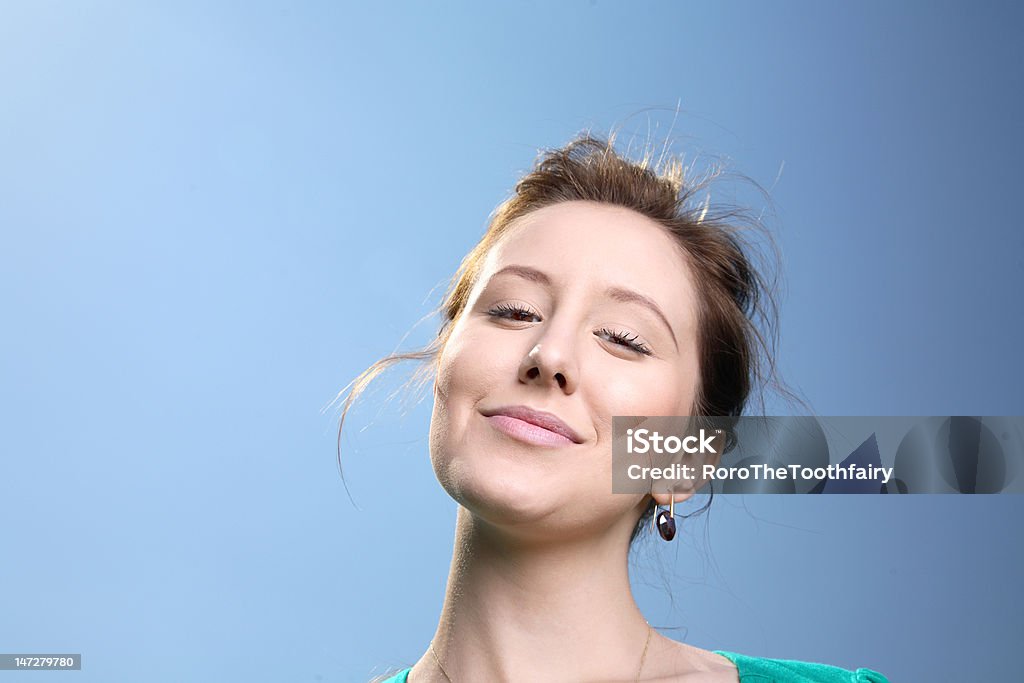 Lovely girl with sky background. Lovely young girl smiling with sky background. 20-29 Years Stock Photo