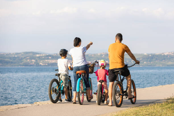 istock Children with parents, recreational cyclists taking a break 1472798758