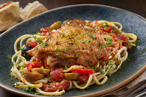 Italian Braised Chicken Thigh Cacciatore with Olives, Onions, Red Peppers, Tomatoes and Linguini