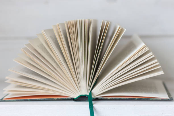 istock Open book isolated on white background. Open book with pages. Education concept. Reading books. Literature background. Wisdom and knowledge. 1472800077