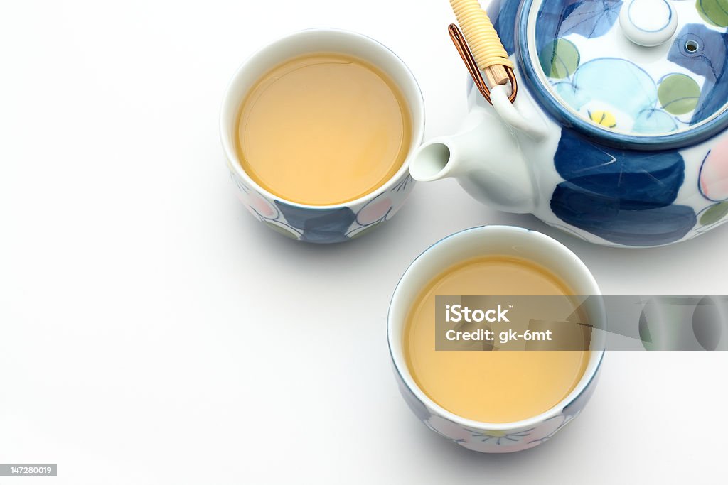 Teiera ornamentale e due tazze di tè - Foto stock royalty-free di Bevanda analcolica