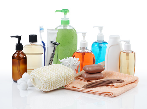 assorted personal hygiene products on white background