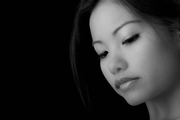 istock Pensive Asian Girl 147280389