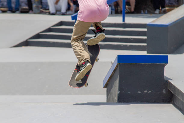 young man performing trick on skateboard in Rio de Janeiro, Brazil - October 14, 2022 : young man performing trick with skateboard on a track in Rio de Janeiro.