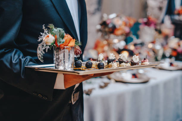 Luxury Delicious Appetizer Serving Professional caterer with white glove serve finger dessert foods during a cocktail wedding parties or events catering. restaurant france stock pictures, royalty-free photos & images