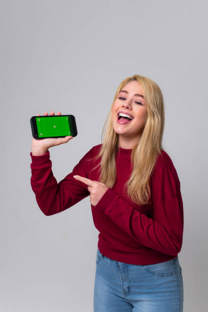 istock young woman at winning moment 1472807997