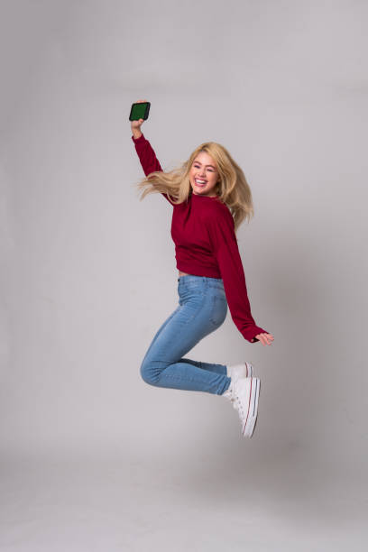 istock young woman at winning moment 1472808004