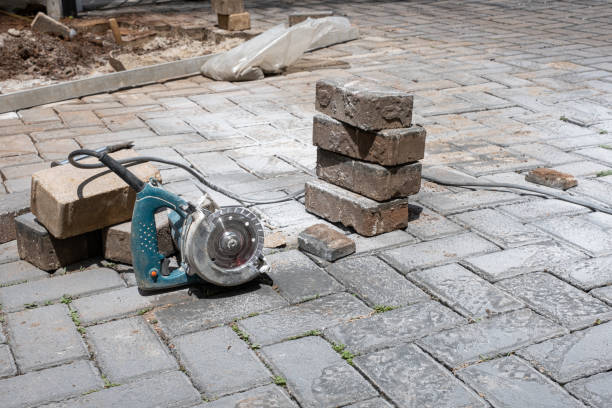 istock Small concrete saw next to stone blocks on a sunny day. 1472808470