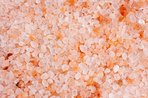 Pink Salt background with free space in the center, free space. Top view.