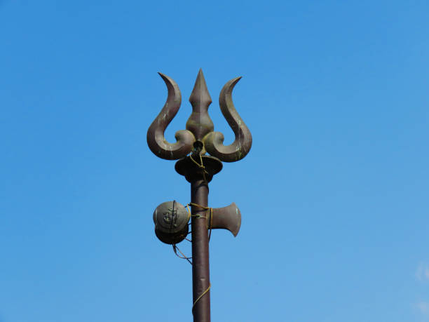 Trident weapon, and ornaments of Lord Shiva. Weapon of God Shiva. Trishul and damaru drum. stock photo