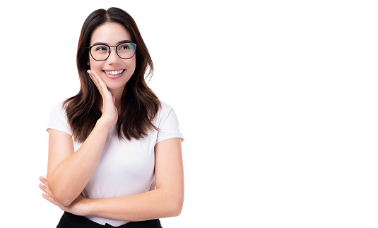 Surprised happy young teen woman looking copy space in excitement Expressive facial expressions Presenting a product Beautiful girl act like a satisfied something Isolated on white background