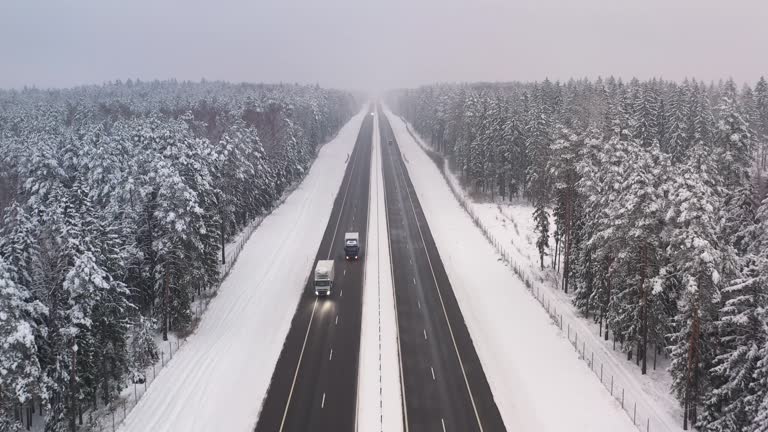 Aerial Flying Over High Speed Intercity Highway Road On Snow Winter Day