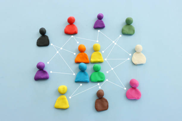 istock Colorful figures connected over blue background, concept of human resources and collaboration. 1472814552