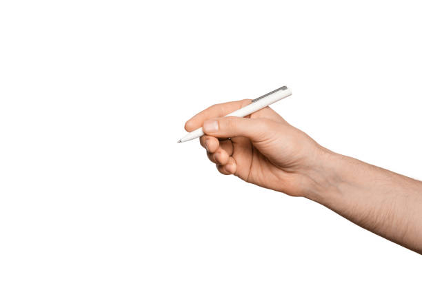 istock Male hand with a white pen for writing, isolate. 1472815012