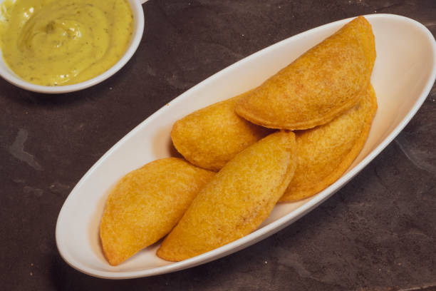 istock Colombian empanada with spicy sauce 1472815194