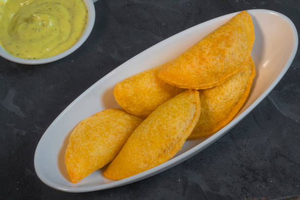 istock Colombian empanada with spicy sauce 1472815548