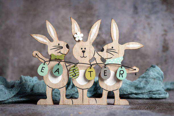 istock Easter, wooden bunny and painted Easter eggs in a bowl 1472816808