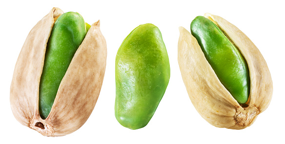 Three pistachio seeds on white background. File contains clipping path.
