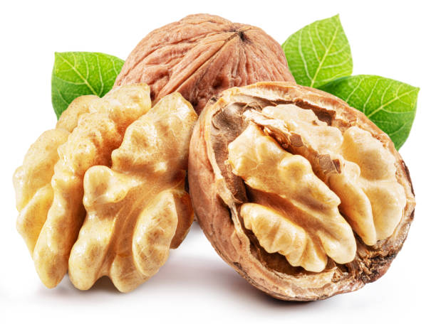 istock Whole walnut and walnut kernel  with leaves isolated on white background. 1472822724
