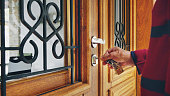 Senior man opening the front door of his vacation rental